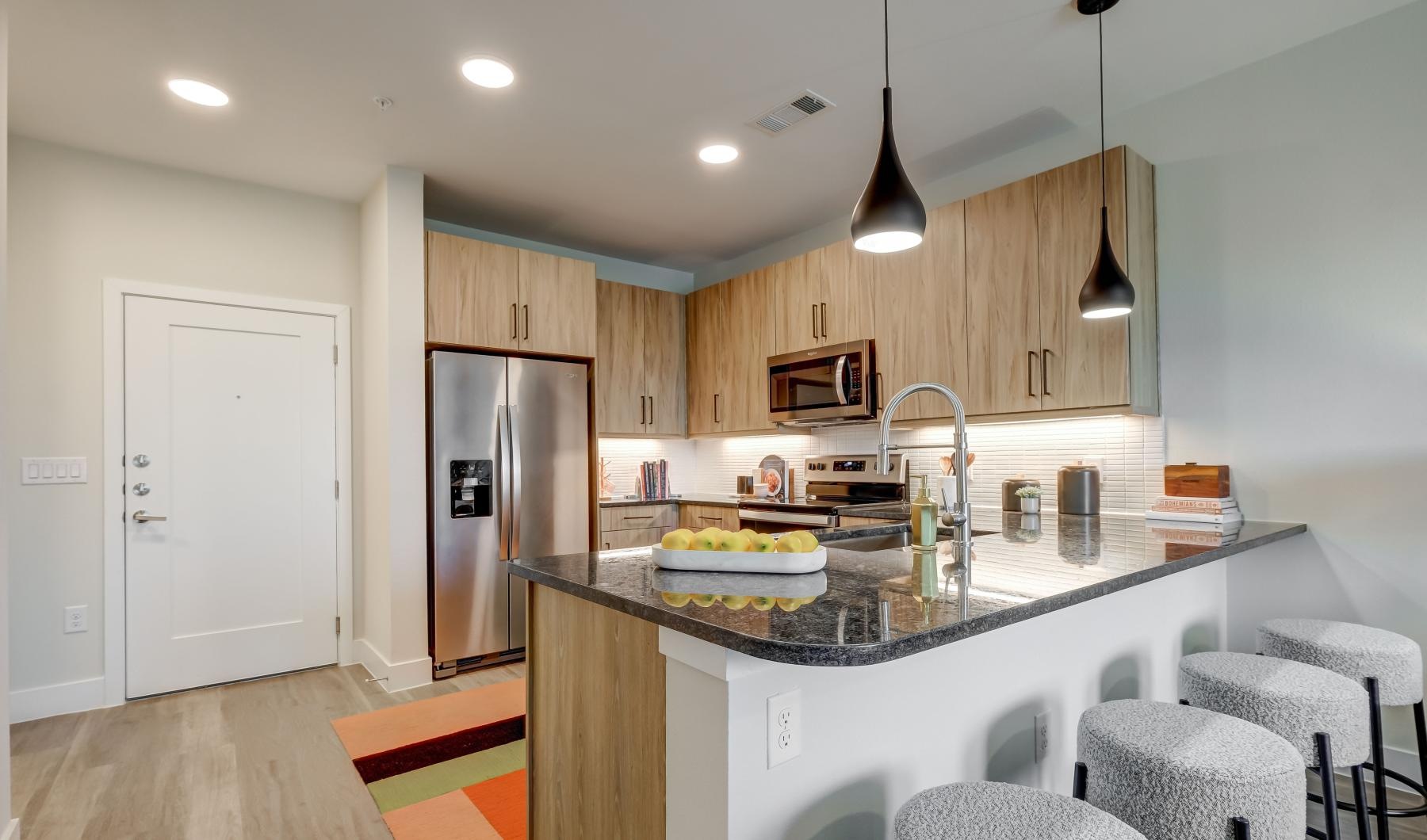 a kitchen with a marble counter top