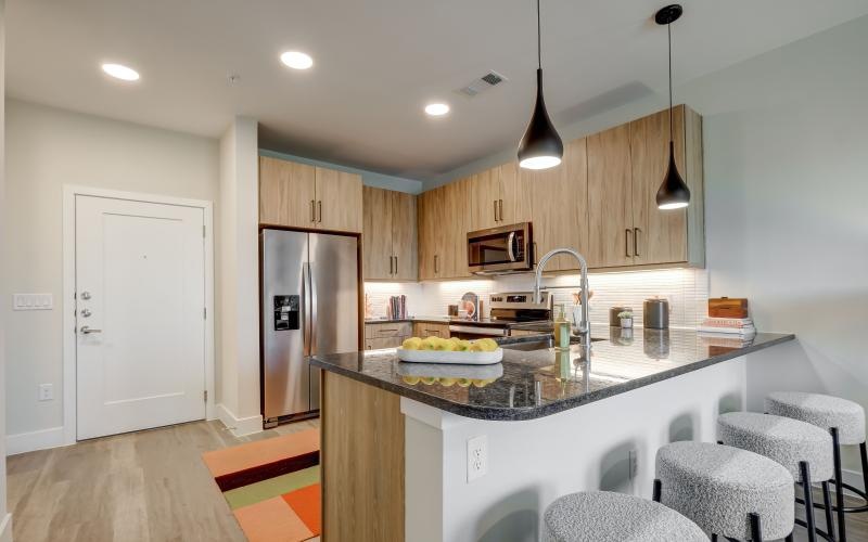 a kitchen with a marble counter top