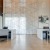 a room with chairs, tv's and tables
