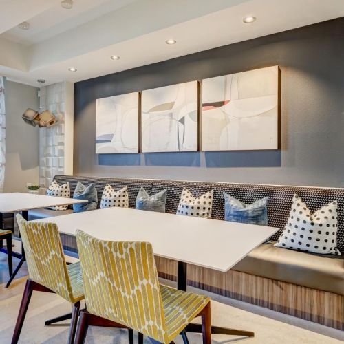 a room with a table chairs and a couch