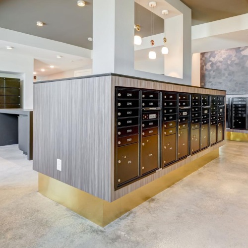 a large mail room with black doors