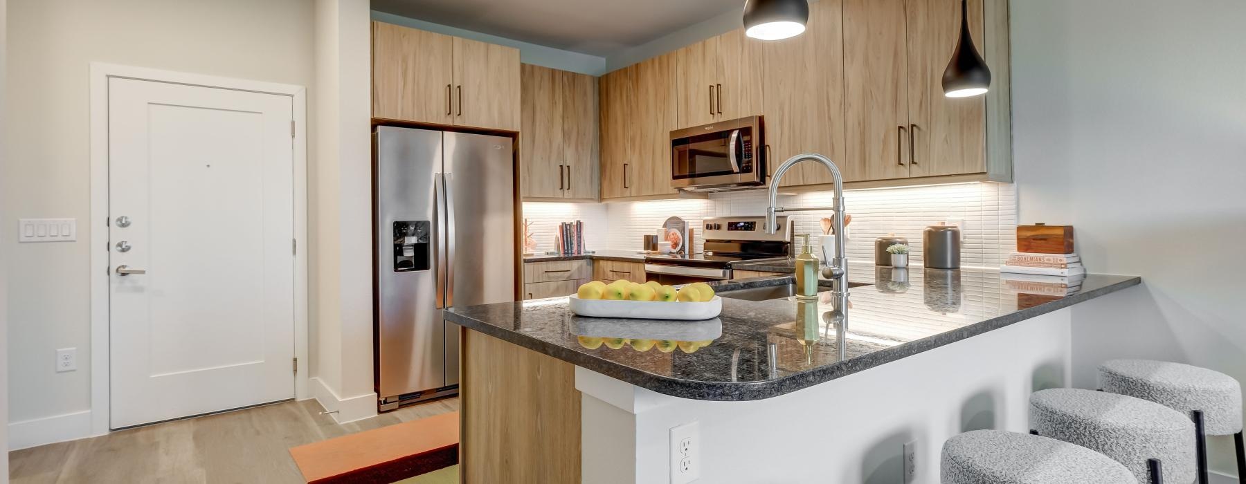 a kitchen with a marble counter top