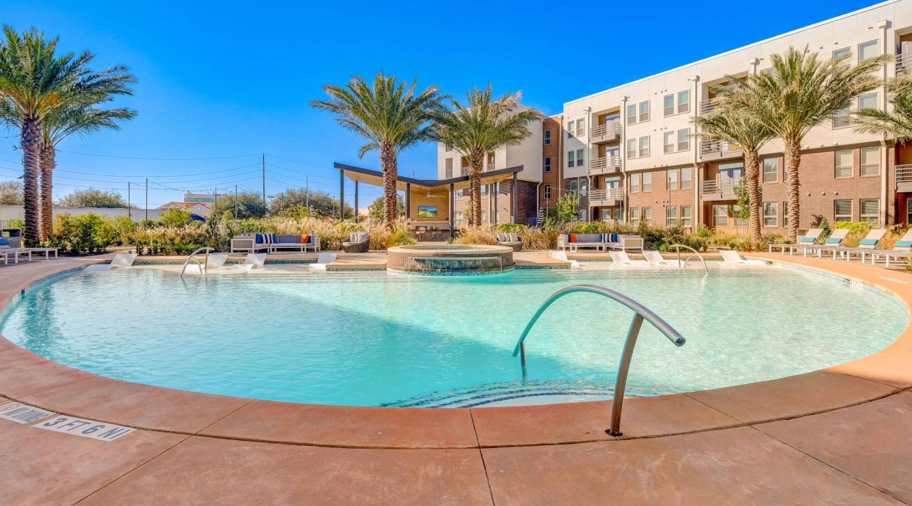 a pool with a building in the background